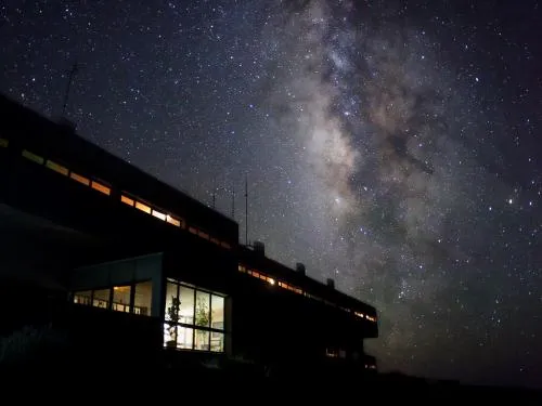 The buildings of the Residencia at night.